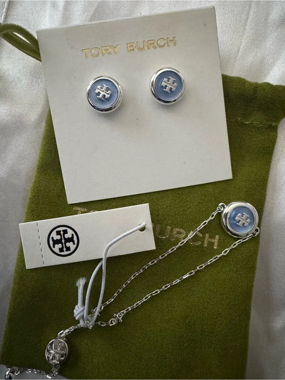 Tory Burch Light Blue Enamel Logo Studs and bracelet set.